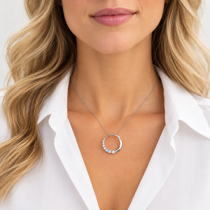 14K White Gold diamond circle pendant with 1.00 ct TW natural diamonds shown on model
