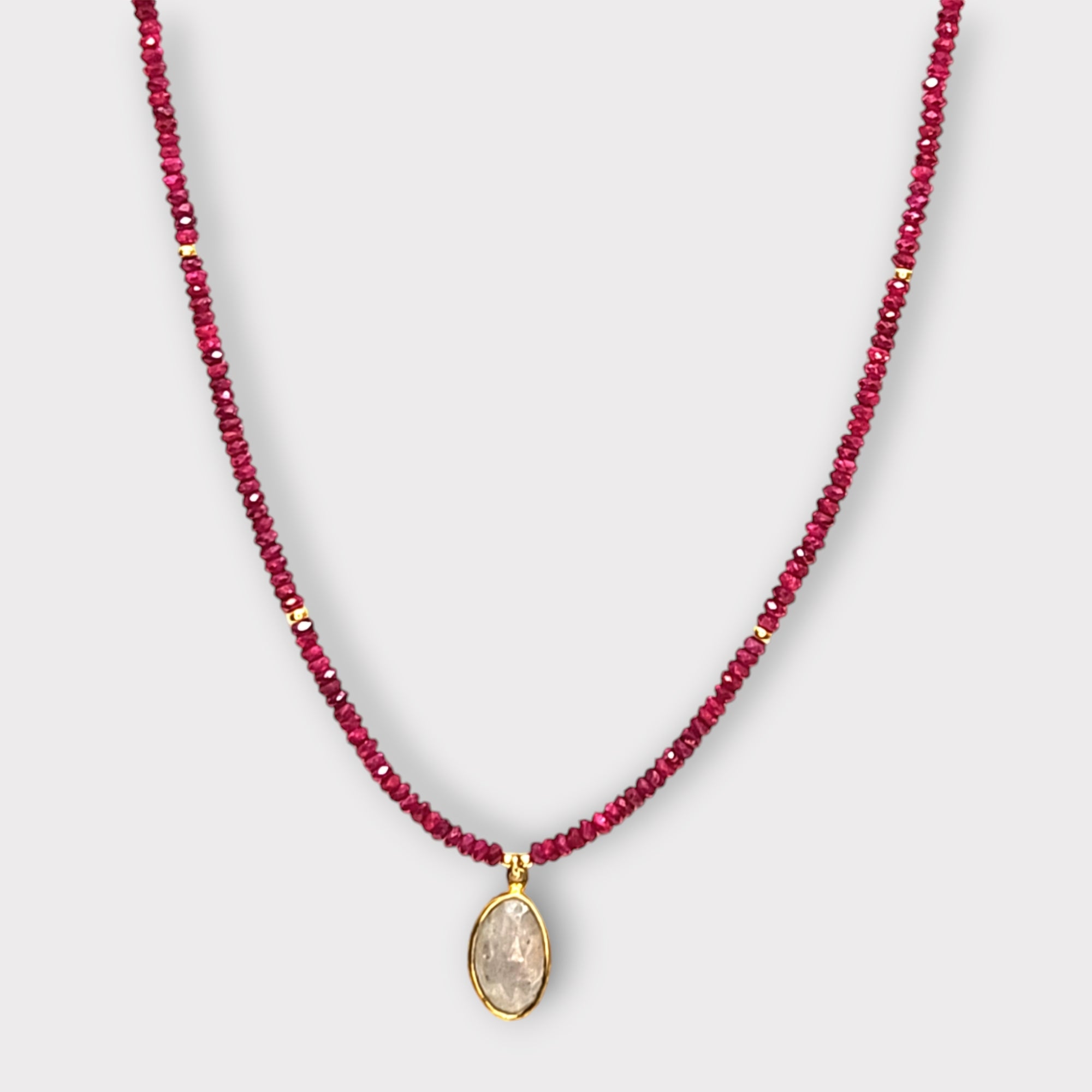 Faceted Ruby Necklace with 14Kt Bezel Set Sapphire