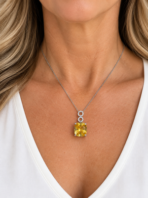 14K White Gold checkerboard-cut citrine and natural diamond pendant worn on a model
