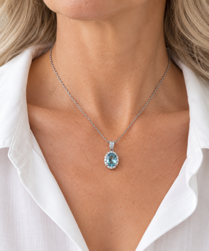 18K White Gold aquamarine and natural diamond pendant worn on a model