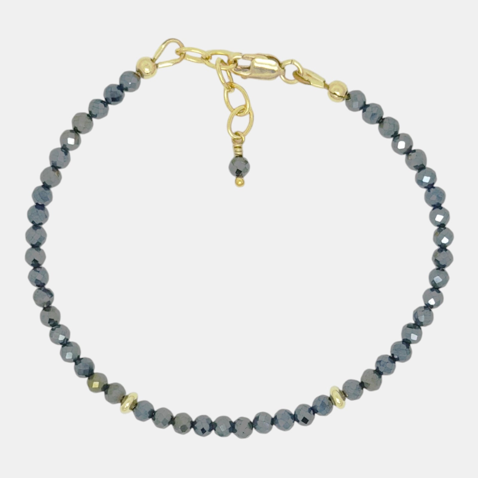 Coated black spinel bracelet with gold-filled accents.