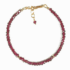 Faceted natural deep red garnet gemstone bracelet with gold-filled accent beads, lobster clasp and chain.