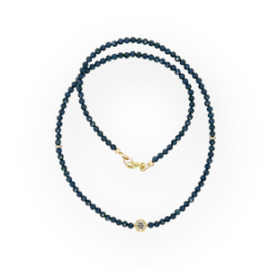 Blue sapphire necklace with black and white diamond pavé bead and solid 14K yellow gold clasp