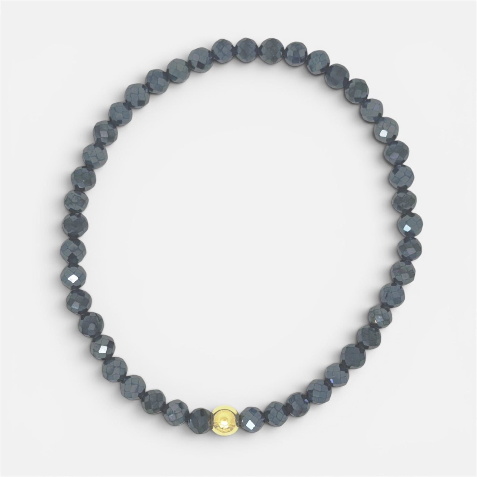 Faceted black spinel stretch bracelet with gold-filled accent bead