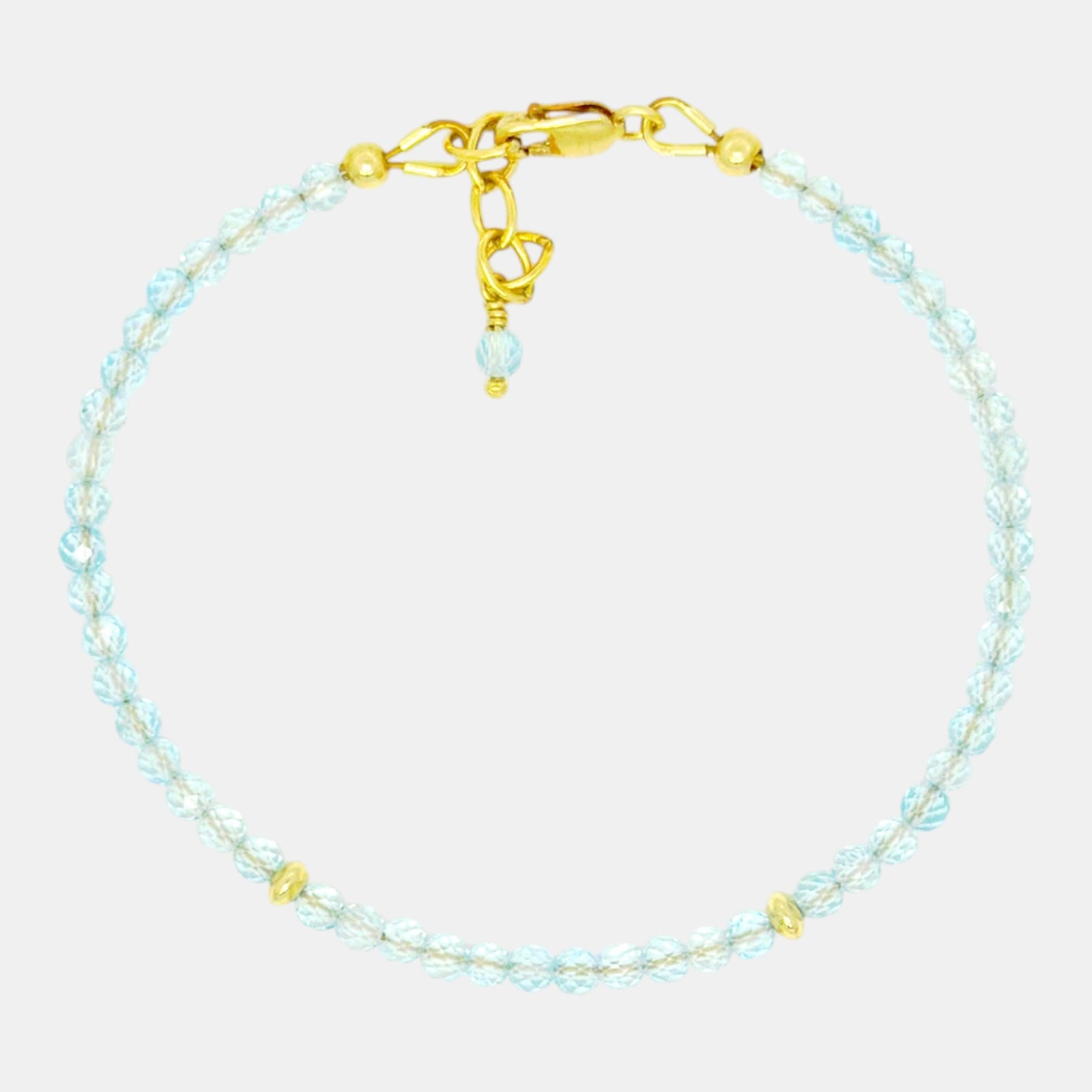 Faceted blue topaz bracelet with gold filled accents and clasp