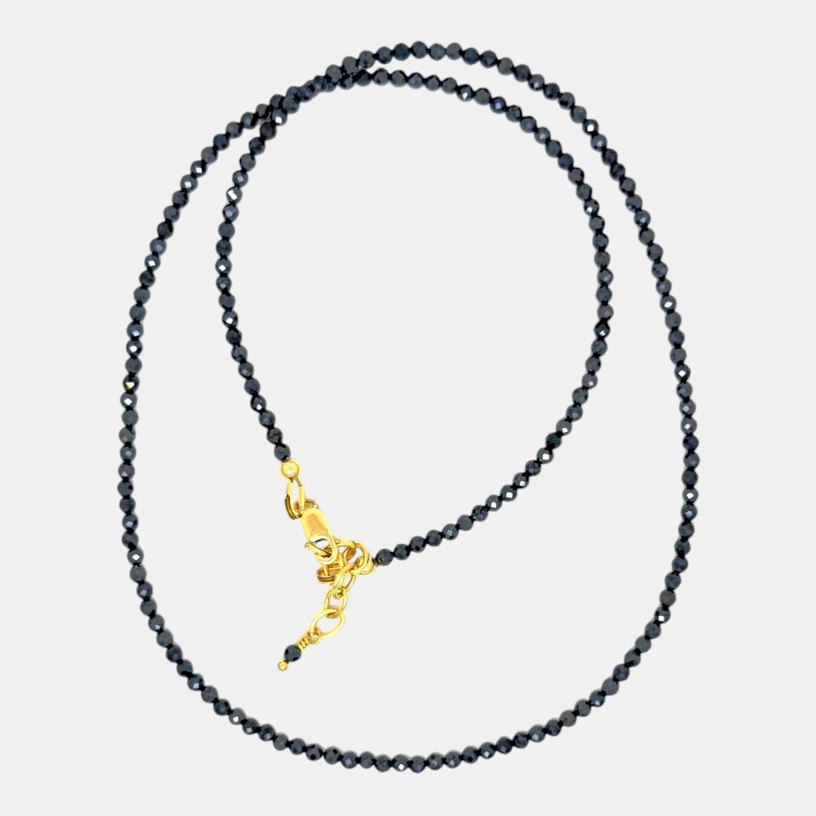 Micro faceted coated black spinel necklace with 2.4 mm gemstones and gold filled clasp