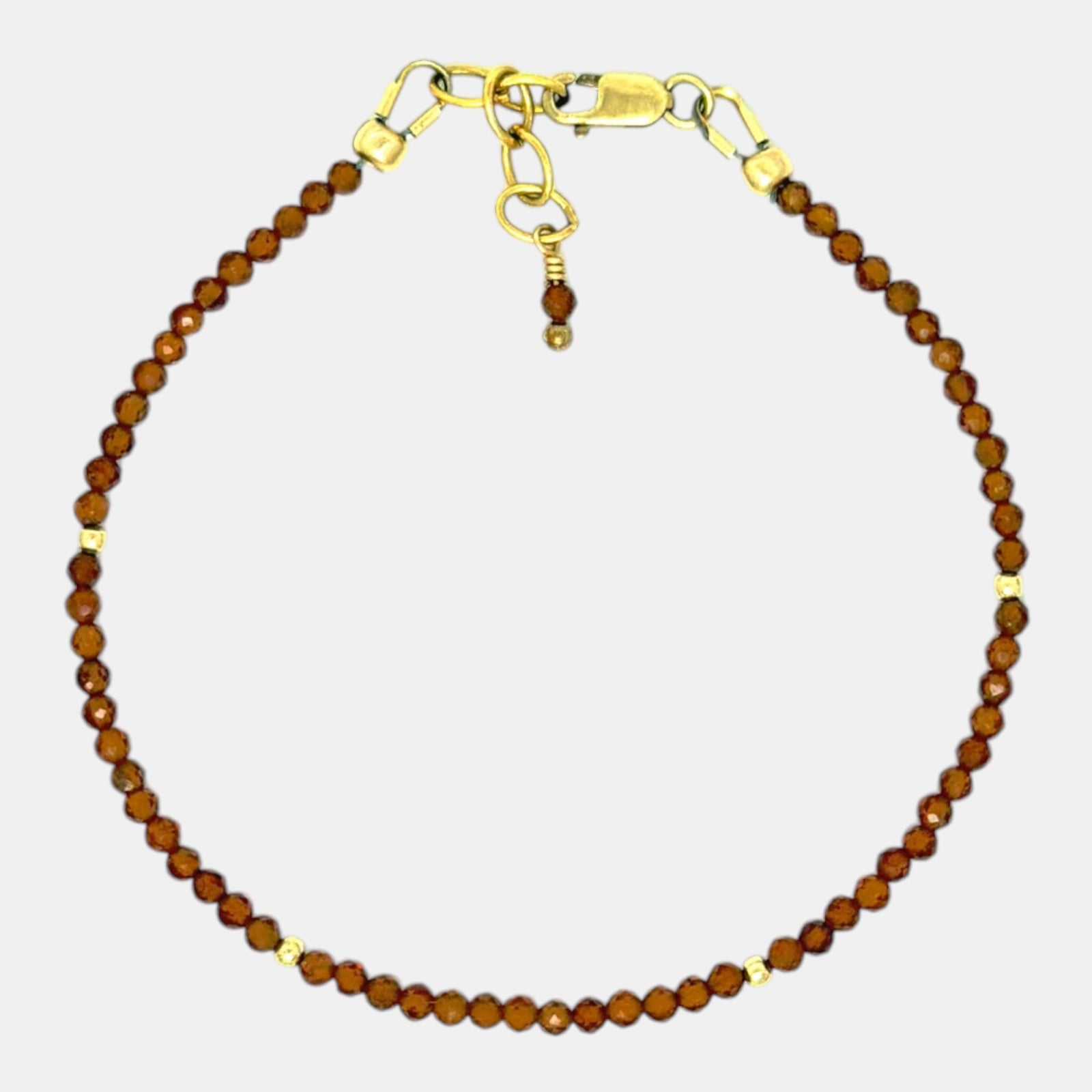 Micro faceted hessonite garnet bracelet with 2.4 mm gemstones and gold filled accents
