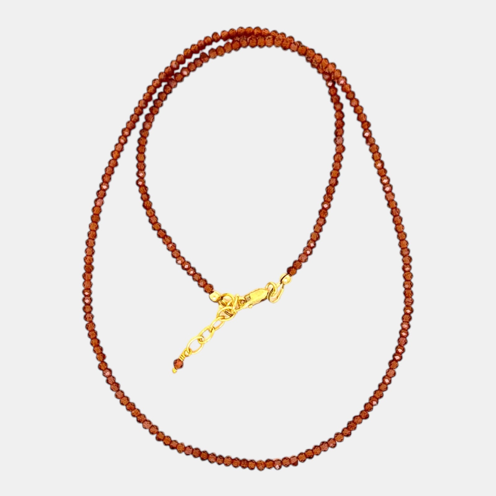 Micro faceted hessonite garnet necklace with 2.4 mm gemstones and gold filled clasp
