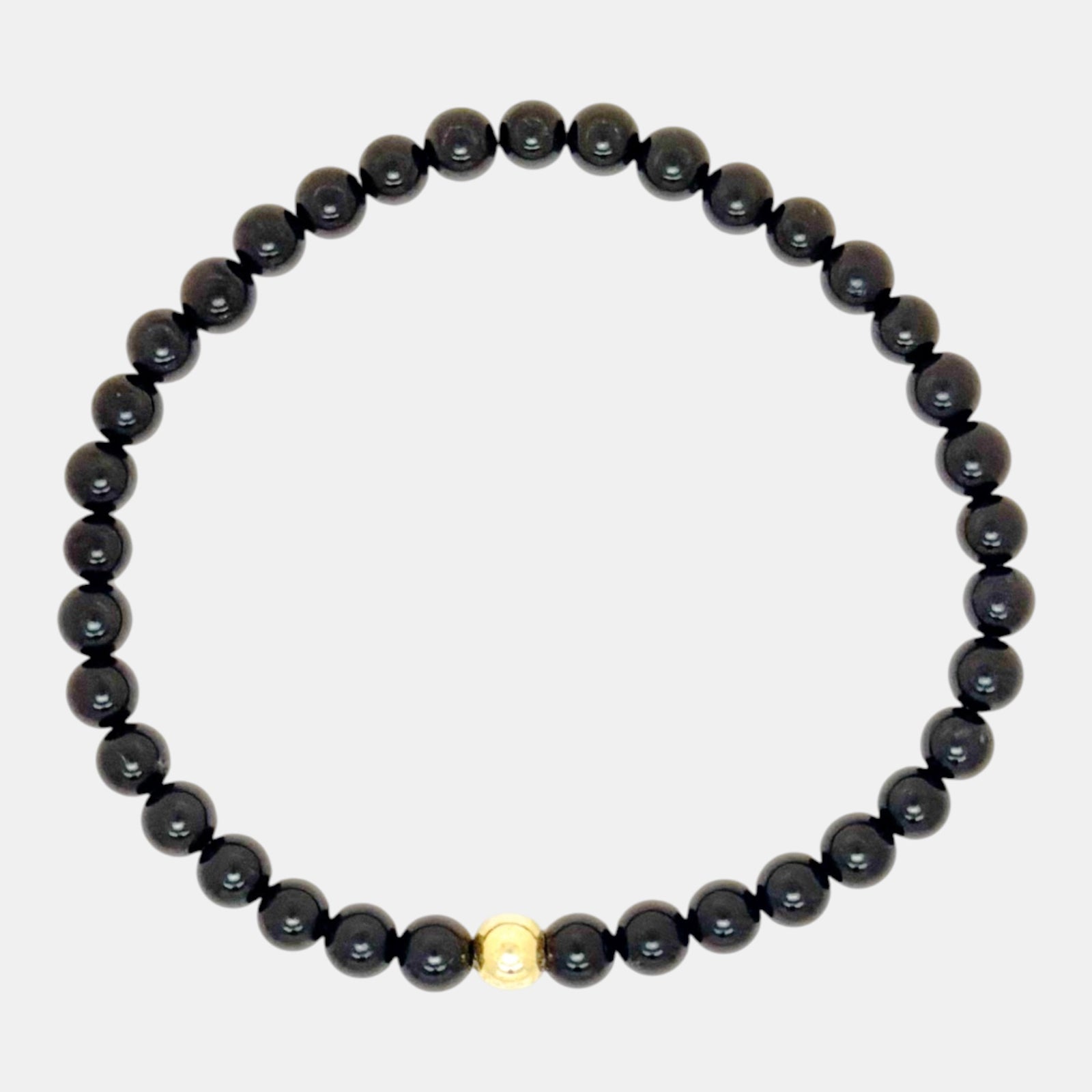 Natural black tourmaline stretch bracelet with gold filled accent bead
