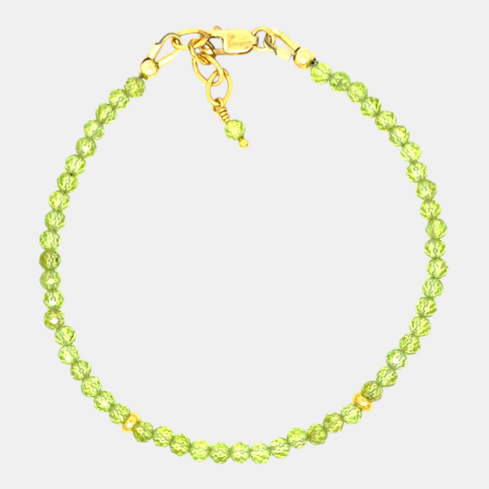 Natural 3.1 mm peridot bracelet with gold-filled clasp and accents.