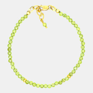Natural 3.1 mm peridot bracelet with gold-filled clasp and accents.